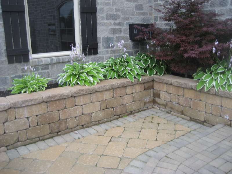 Paver patio and raised bed with decorative retaining wall